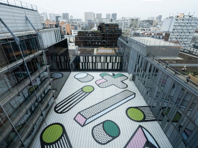 a rooftop with a drawing on the ground