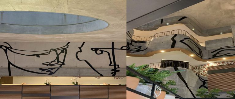 a collage of a building with a staircase and a wall with a face drawn on it